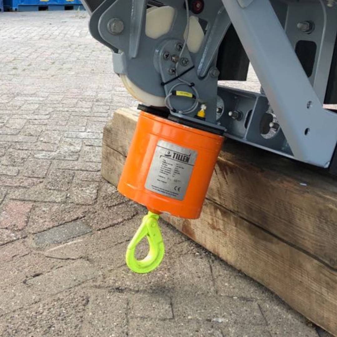 Rigging and testing a 1 ton hook block attached to a frame